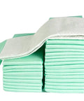 Heavy Duty 300 Pack Disposable Underpads 23x36 Inch stacked pads showcasing triple layer build for absorbent protection.
