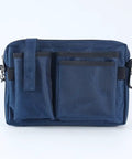 Heavy Duty Utility Waist Pack With Modular Tool Dividers And Waterproof Zippers For Job Site Hustlers Seeking Kick Ass Storage For Drill Bits Pliers And Pro Gear Built Tough As Nails Every Single Shift in navy blue with multiple pockets.