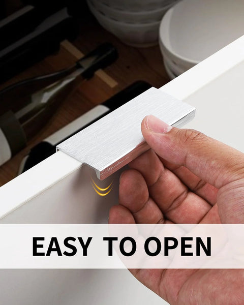 Hand using 5 Pack 3 Inch Self Adhesive Cabinet Pulls Silver Stick On Handles No Drill Concealed Edge Drawer