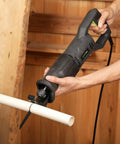User operating a Heavy Duty Corded Reciprocating Saw 120V With 6.0 Amp Motor And 2800 RPM cutting PVC pipe.