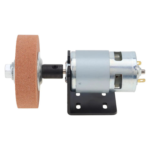 RS775 Compact DC Motor Sander Polisher Kit 12V 24V 120W Brushed Build With 5Mm Shaft mounted on a black plate with corundum wheel.