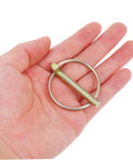 Heavy Duty Lynch Pin Set With Rings Spring Loaded Iron Fasteners For Trailers Trucks And Lawn Mowers Shaft Locking Pin Assortment Kit 8 Pieces Built To Take A Beating Dirt Resistant Mower Pin, single iron pin in hand
