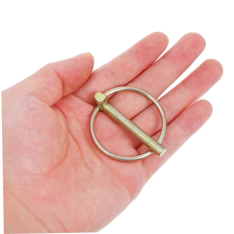 Heavy Duty Lynch Pin Set With Rings Spring Loaded Iron Fasteners For Trailers Trucks And Lawn Mowers Shaft Locking Pin Assortment Kit 8 Pieces Built To Take A Beating Dirt Resistant Mower Pin, single iron pin in hand