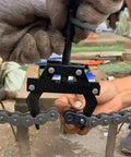 Beefy Chain Breaker Tool For 100 To 200 Roller Chains in action on a roller chain, showing heavy duty two-claw design.