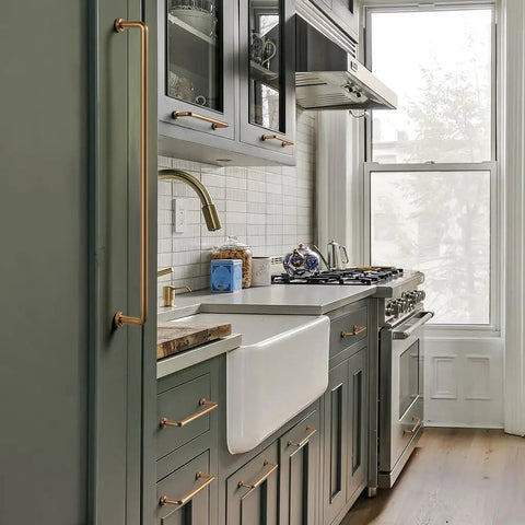 Modern kitchen with Six Pack Cabinet Pulls Center To Center Seven And Nine Sixteenths Inch Warm Champagne Bronze handles.