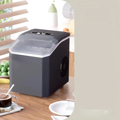 Compact Countertop Ice Maker Crafting Quick Bullet Ice In Six Minutes Flat on kitchen table with coffee and snacks.