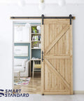 Heavy Duty Sliding Barn Door Hardware Kit In Black shown on wooden door, includes pull handle set and floor guide