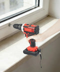 Heavy Duty Cordless Power Drill Featuring Variable Speed Trigger And Slick Ergonomic Handle Includes Plug And Play 1200 Mah Battery For Tough Wood And Ceramic Applications, in use at a window.