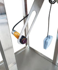 Close-up of automatic stainless steel powder filling machine's infrared sensor for precise measurement.