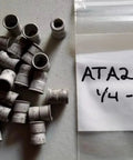 Aluminum Knurled Rivet Nut Insert 1/4-20 UNC Plated, shown scattered on surface with labeled bag, 25 pack