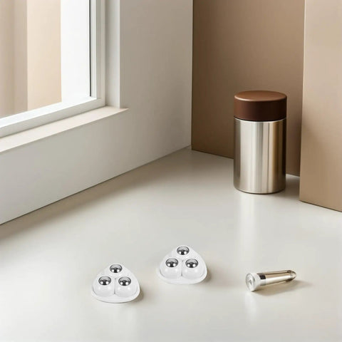 Small Swivel Caster Set With Adhesive Mounting And Triple Ball Bearings for smooth furniture glide, showcased on a table.