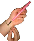 Pink Bracelet Fastener Tool For Easy Jewelry Clasping, Sturdy Steel Clip With Hardwood Handle in use clasping a bracelet