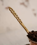 Close-up of handle on Arabic Coffee Pot Cezve Turkish Coffee Maker For 3 Cups Medium Size With Hammered Copper Exterior And Stainless Steel