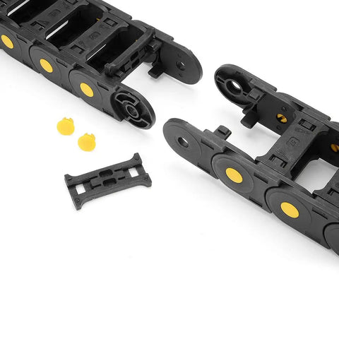 Close-up of R55 25mm By 57mm Open Type Plastic Cable Drag Chain Carrier for wires, showing connectors and yellow details.