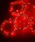 300 LED Curtain String Lights with USB Power and Remote Control coiled red lights on a dark background