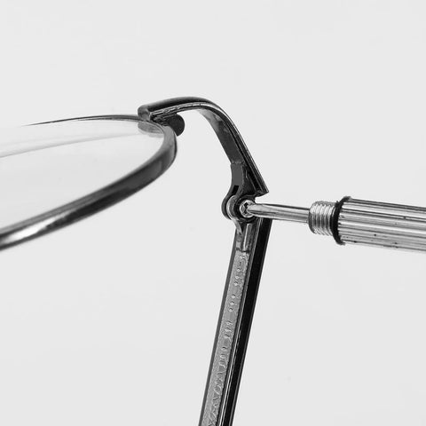 Close-up of All In One Eyeglass Repair Kit With Screws And Screwdrivers For Frames And Arms Universal Replacement Temples Hinges