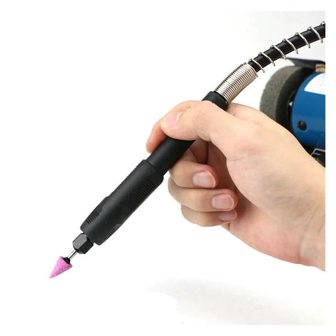 Hand holding detailed tool attachment for Top Shelf Mini Bench Grinder With Quick Adjust Speed Dial for engraving tasks.
