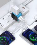 Worldwide Travel Adapter With 2.4 Amp USB Charging And 3 USB A Ports Plus USB C Fast Charge Universal Wall Charger in use.