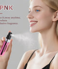 Woman using pink Super Portable Mini Refillable Perfume Atomizer Bottles Set - 5 Pack Of Travel Size 5ml Spray Options With Handy Bag