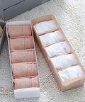 Six Piece Pink Plastic Underwear Drawer Organizer Set Smooth Dresser Storage Dividers with rolled socks in bins.