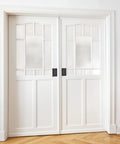 White double doors with Six Pack Zinc Alloy Recessed Pull Handle 4.4 By 2.7 Inches Flush Lift Door Handle in black installed.