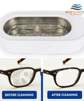 Ultrasonic eyeglass cleaner in white plastic housing with glasses inside (front view)