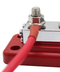 Hella Heavy Duty Copper Bus Bar Providing 600 Amp Juice For Rock Solid 8 Way Distribution Block Grounding And Smooth Auto Battery Wiring In Classic Red And Black, close-up showing connection.