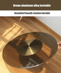 Big Round Glass Lazy Susan Turntable For Dining Table with aluminum base, depicting a hand rotating the smooth glass surface.