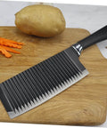 Solustre wavy chopper knife with stainless steel blade and black handle on cutting board.