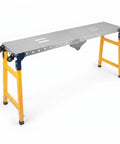 Hella Heavy Duty Collapsible Welding Table 1100 Lb Foldable Steel Workbench For Metalworking with yellow legs and metallic surface.