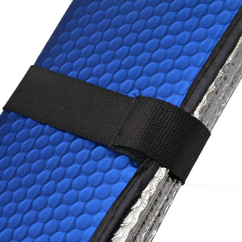 Close-up of thermal blocking auto sunshade with blue bubble texture and black strap, part of premium car accessory gift bundle. Level Up Your Slick Ride With This Premium Car Accessory Gift Bundle Featuring Thermal Blocking Auto Sunshade Two Tone Carpet Floor Mats And Ergonomic Grip Steering Wheel Cover For Trucks Vans SUVs.