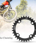 96BCD Narrow Wide Mountain Chainring 32T Round Replacement for MTB with cyclist descending a trail