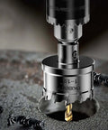4-piece tungsten carbide hole saw set mounted on drill, 3/4"–1-1/2" sizes, 1" cut depth.