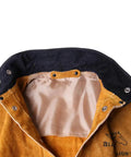 Close-up of Split Cowhide Welding Jacket with Stand Up Corduroy Collar, satin lining visible, for sparks, heat, and spatter protection.
