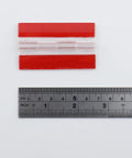 Self Adhesive Clear Acrylic Hinges For Cabinets Drawers And Furniture DIY Projects Transparent 65mm By 40mm with ruler scale showing size.