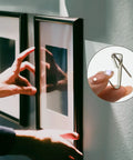 Using 136 Pcs Picture Hangers Kit With 5 Size Hooks 10Lb 20Lb 30Lb 50Lb 100Lb Nails And Handy Storage Case For Drywall And Wooden Walls All In One Heavy Duty Metal Hanger Set For Framed Art Photos And Gallery Walls to hang framed artwork on a wall.