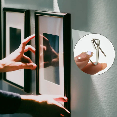 Using 136 Pcs Picture Hangers Kit With 5 Size Hooks 10Lb 20Lb 30Lb 50Lb 100Lb Nails And Handy Storage Case For Drywall And Wooden Walls All In One Heavy Duty Metal Hanger Set For Framed Art Photos And Gallery Walls to hang framed artwork on a wall.