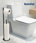 Free Standing Black Toilet Paper Holder Stand With Reserve Storage Space Saving Bathroom Roll Holder next to white toilet