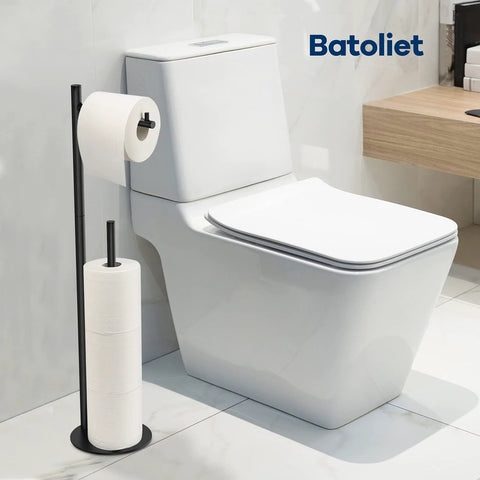 Free Standing Black Toilet Paper Holder Stand With Reserve Storage Space Saving Bathroom Roll Holder next to white toilet