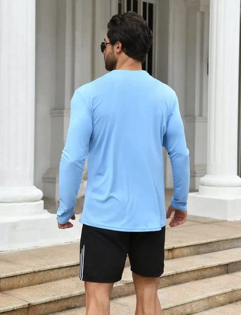 Man wearing blue long sleeve from Two Pack Men's UPF Fifty Plus Dope Rash Guard Long Sleeve Swim Shirts With Quick Dry Tech