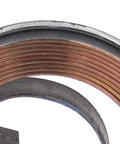 Close-up of Durable Steel Drill Press Return Spring Set For Bench Drills showing coiled spring in steel assembly
