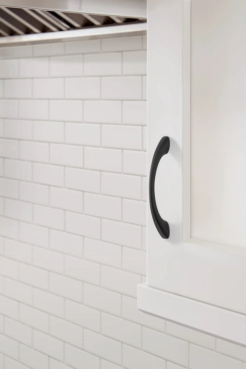 Vaile Matte Black Cabinet Pull 3-3/4 Inch Center to Center installed on a white cabinet, showcasing modern drawer handle.