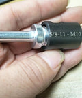 Slick Two Pack 5811 Male Thread To Quarter Inch Round Shank Drill Adapter shown in hand, featuring steel construction for electric grinders.