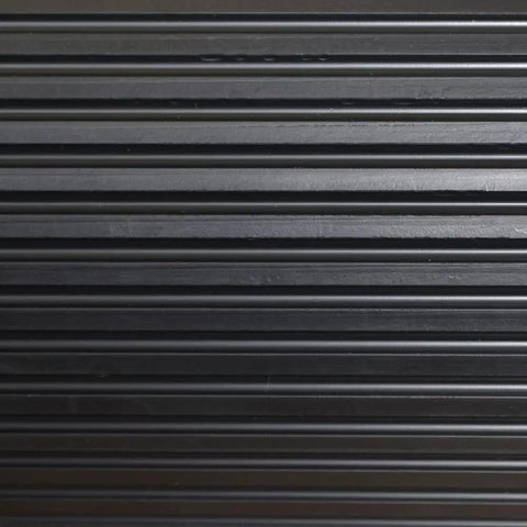 Close-up of black corrugated surface of Indoor Outdoor Rubber Scraper Mat For High Traffic Areas 36 Inch By 6 Foot Heavy Duty Doormat
