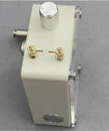 Side view of USB Rechargeable Handheld Power Station For Outdoors on gray surface, showing knobs and connectors.