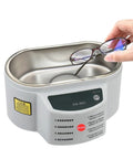 Massive 30 50 Watt Digital Ultrasonic Cleaner Bath For Jewelry And Glasses with glasses being placed inside the tank.
