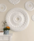 Ceiling Medallion With Thirty Five And One Eighth Inch Outer Diameter And Four And Seven Eighth Inch Inner Opening, displayed on wall