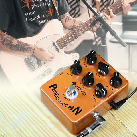 American Tube Amp Simulator And Preamp Guitar Pedal With Built In Cab Sim 6 Knob Tone Control True Bypass next to electric guitar.