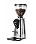 Badass Espresso Coffee Grinder With 64mm Flat Burrs And Programmable Digital Timer showcasing shiny silver design and coffee bean hopper.