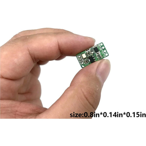 Hand holding Dope Remote Control Switch Module For DC 3V To 12V Motors With Forward And Reverse Stop Mini RF Wireless Controller
